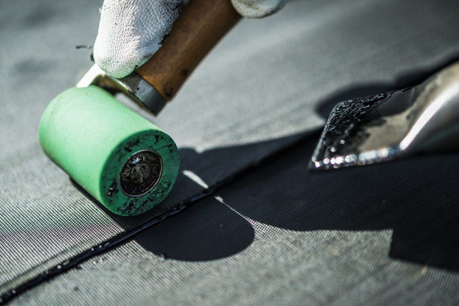 Roof Rubber EPDM Membrane Installation Close Up. Roofing Industry Theme.