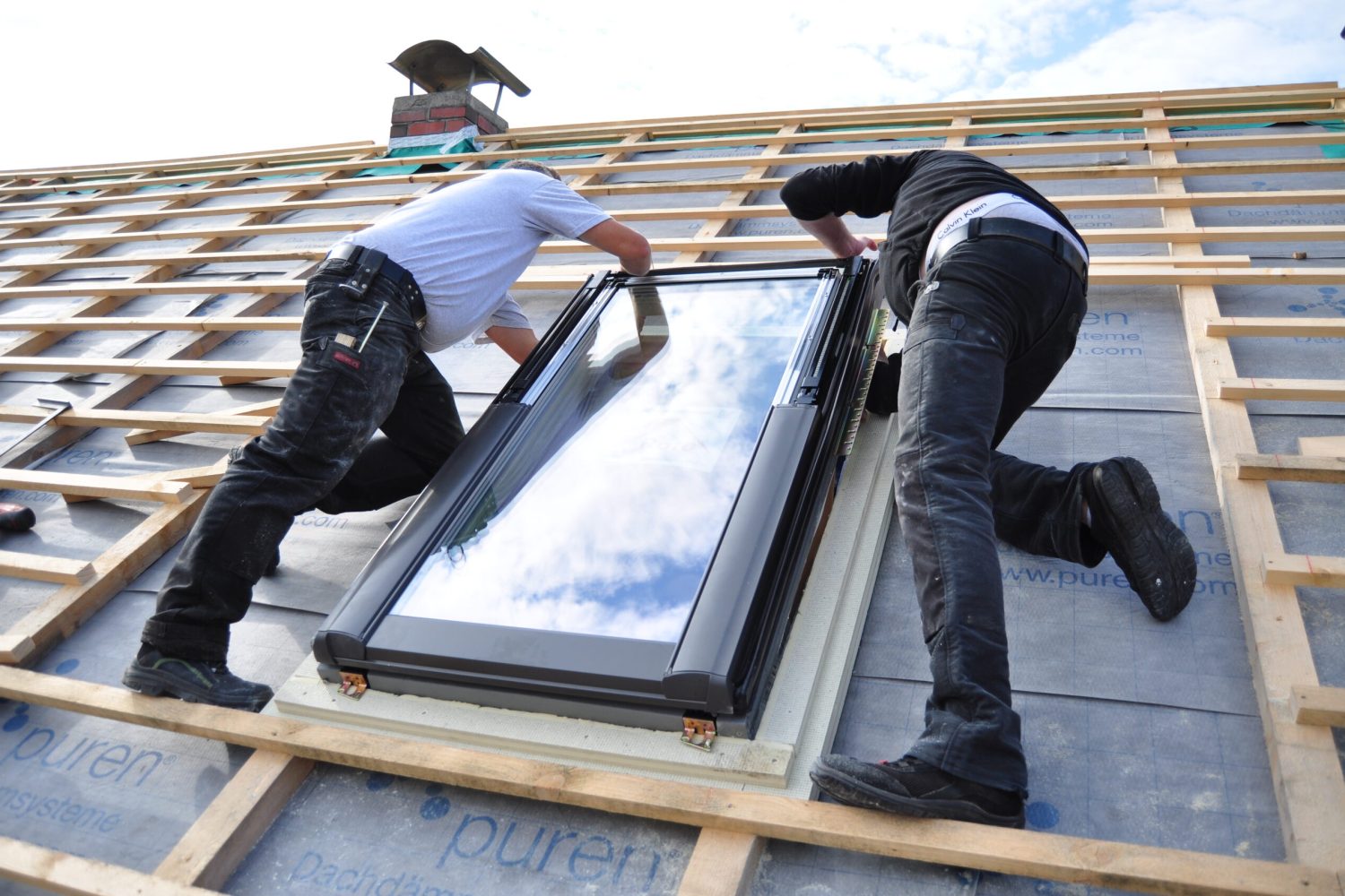 two-men-assembling-a-roof-skylight-window-2023-11-27-05-23-24-utc (3)